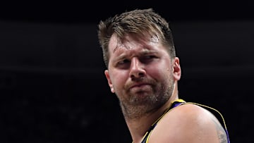 Feb 22, 2025; Denver, Colorado, USA; Los Angeles Lakers guard Luka Doncic (77) reacts to a fan yelling after being fouled during the second half against the Denver Nuggets at Ball Arena. Mandatory Credit: Christopher Hanewinckel-Imagn Images