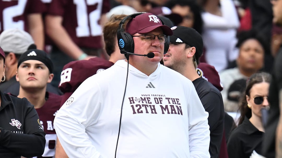 Dec 20, 2025; College Station, TX, USA; Texas A&M Aggies head coach Mike Elko reacts during the first quarter during the first round of the CFP National Playoff against the Miami Hurricanes at Kyle Field. Mandatory Credit: Maria Lysaker-Imagn Images