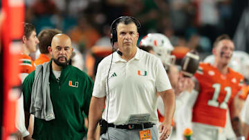 Sep 6, 2025; Miami Gardens, Florida, USA; Miami Hurricanes head coach Mario Cristobal looks on from the sideline against the Bethune-Cookman Wildcats during the second quarter at Hard Rock Stadium. Mandatory Credit: Sam Navarro-Imagn Images