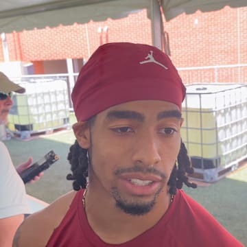 Oklahoma receiver Isaiah Sategna speaks to reporters after a fall camp practice on Wednesday.