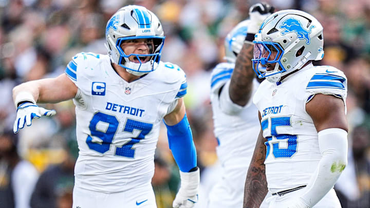 Detroit Lions linebacker Derrick Barnes (55) celebrates a tackle against Green Bay Packers with defensive end Aidan Hutchinson (97) during the second half at Lambeau Field in Green Bay, Wis., on Sunday, September 7, 2025.