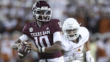 Texas A&M Aggies quarterback Marcel Reed looks for an open receiver as Texas Longhorns linebacker Trey Moore defends during the fourth quarter at Kyle Field.