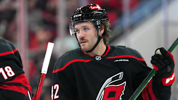 Jan 4, 2025; Raleigh, North Carolina, USA;  Carolina Hurricanes defenseman Ty Smith (42) looks on against the Minnesota Wild during the first period at Lenovo Center. Mandatory Credit: James Guillory-Imagn Images