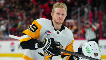 Jan 13, 2024; Raleigh, North Carolina, USA;  Pittsburgh Penguins left wing Jake Guentzel (59) looks on at the start of the game against the Carolina Hurricanes at PNC Arena. Mandatory Credit: James Guillory-USA TODAY Sports