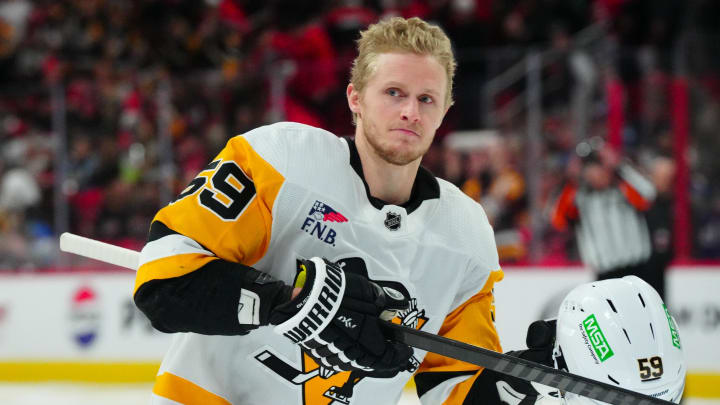 Jan 13, 2024; Raleigh, North Carolina, USA;  Pittsburgh Penguins left wing Jake Guentzel (59) looks on at the start of the game against the Carolina Hurricanes at PNC Arena. Mandatory Credit: James Guillory-USA TODAY Sports