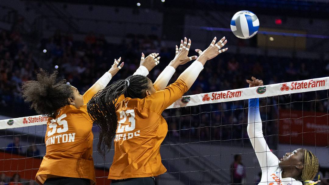 Florida outside hitter Jordyn Byrd (14) hits past Texas middle blocker Nya Bunton (55) and outside hitter Cari Spears (23) during an NCAA women’s volleyball game at Steven C. O'Connell Center Exactec arena in Gainesville, FL on Friday, November 7, 2025. [Alan Youngblood/Gainesville Sun]