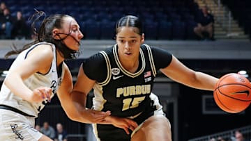 Butler Bulldogs forward Riley Makalusky (2) defends Purdue Boilermakers forward Mila Reynolds (15) 