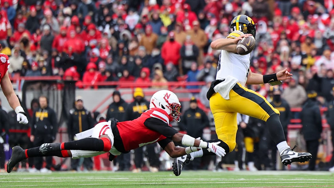 Iowa quarterback Mark Gronowski evades the rush and finds an open receiver to extend the drive in the third quarter. He would score a rushing touchdown a few plays later.