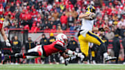 Iowa quarterback Mark Gronowski evades the rush and finds an open receiver to extend the drive in the third quarter. He would score a rushing touchdown a few plays later.