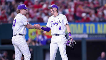 Preston Gamster and Tommy LaPour hi-five after the Frogs record another out. 