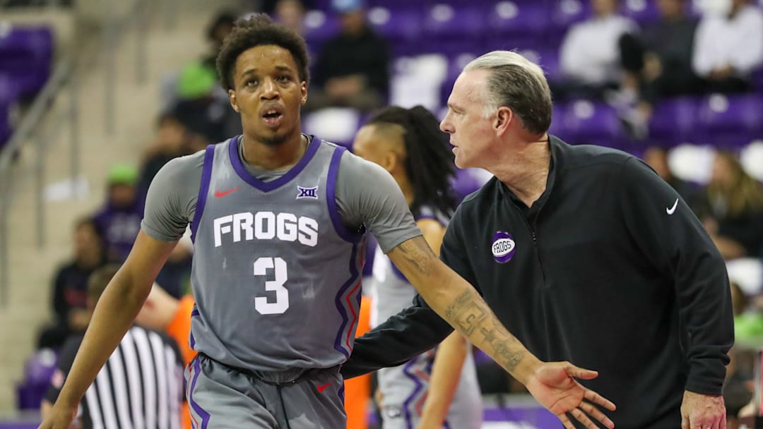 Vasean Allette receives encouragement from TCU head coach Jamie Dixon.