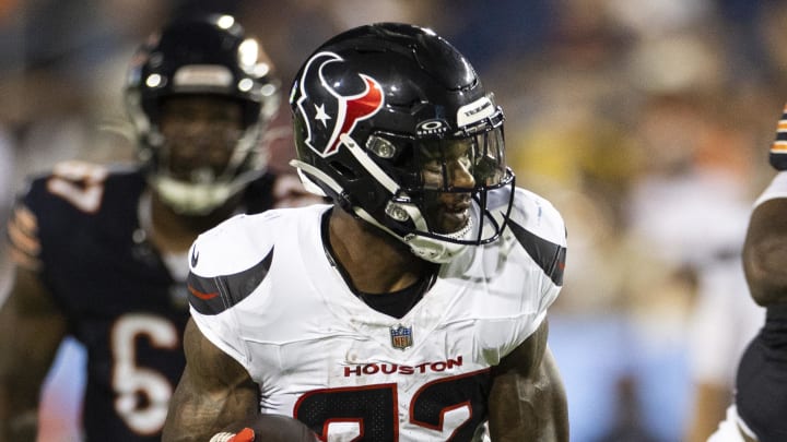 Aug 1, 2024; Canton, Ohio, USA; Houston Texans running back Cam Akers (22) runs the ball against the Chicago Bears during the second quarter at Tom Benson Hall of Fame Stadium. Mandatory Credit: Scott Galvin-USA TODAY Sports