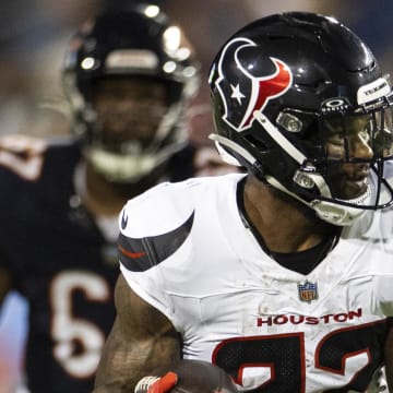 Aug 1, 2024; Canton, Ohio, USA; Houston Texans running back Cam Akers (22) runs the ball against the Chicago Bears during the second quarter at Tom Benson Hall of Fame Stadium. Mandatory Credit: Scott Galvin-USA TODAY Sports