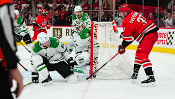 Feb 24, 2024; Raleigh, North Carolina, USA;  Carolina Hurricanes right wing Andrei Svechnikov (37) shot attempt is stopped by Dallas Stars goaltender Jake Oettinger (29) and defenseman Ryan Suter (20) during the third period at PNC Arena. Mandatory Credit: James Guillory-Imagn Images