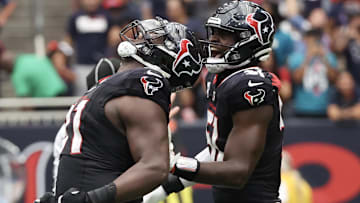 Sep 29, 2024; Houston, Texas, USA;  Houston Texans defensive tackle Folorunso Fatukasi (91) and teammates react after stopping Jacksonville Jaguars quarterback Trevor Lawrence (16) on fourth down in the second half at NRG Stadium. Mandatory Credit: Thomas Shea-Imagn Images