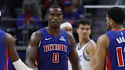 Oct 29, 2025; Detroit, Michigan, USA; Detroit Pistons center Jalen Duren (0) receives congratulations from guard Caris LeVert (8) and forward Tobias Harris (12) in the first half against the Orlando Magic at Little Caesars Arena. Mandatory Credit: Rick Osentoski-Imagn Images