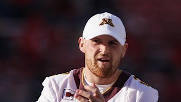 Nov 26, 2022; Madison, Wisconsin, USA;  Minnesota Golden Gophers quarterback Tanner Morgan (2) looks on during warmups prior to the game against the Wisconsin Badgers at Camp Randall Stadium. Mandatory Credit: Jeff Hanisch-Imagn Images