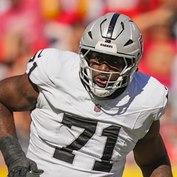 Oct 19, 2025; Kansas City, Missouri, USA; Las Vegas Raiders offensive tackle DJ Glaze (71) blocks against Kansas City Chiefs defensive end George Karlaftis (56) during the first half at GEHA Field at Arrowhead Stadium. Mandatory Credit: Jay Biggerstaff-Imagn Images