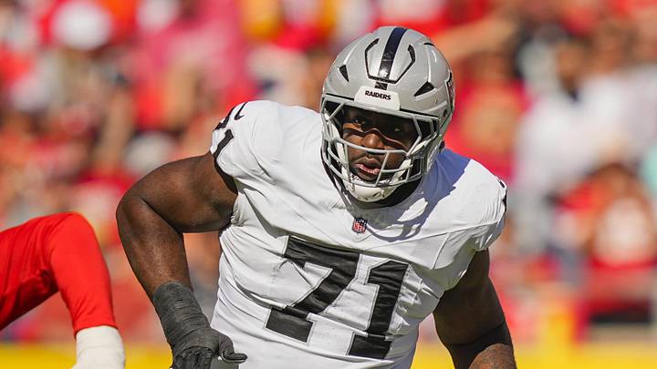 Oct 19, 2025; Kansas City, Missouri, USA; Las Vegas Raiders offensive tackle DJ Glaze (71) blocks against Kansas City Chiefs defensive end George Karlaftis (56) during the first half at GEHA Field at Arrowhead Stadium. Mandatory Credit: Jay Biggerstaff-Imagn Images
