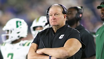 Charlotte became the latest American Athletic Conference school in the last three days to fire its football coach, kicking Biff Poggi to the curb less than two years on the job.