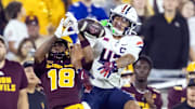 Nov 28, 2025; Tempe, Arizona, USA; Arizona Wildcats defensive back Dalton Johnson (43) breaks up a pass to Arizona State Sun Devils wide receiver Jalen Moss (18) in the second half during the 99th Territorial Cup at Mountain America Stadium. Mandatory Credit: Mark J. Rebilas-Imagn Images