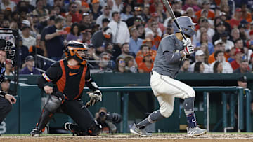 May 7, 2024; Washington, District of Columbia, USA; Washington Nationals outfielder Eddie Rosario (8) hits an RBI single against the Baltimore Orioles during the seventh inning at Nationals Park.