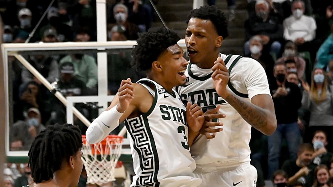Dec 1, 2021; East Lansing, Michigan, USA;  Michigan State Spartans guard Jaden Akins (3) and forward Marcus Bingham Jr. (30) celebrate a scoring run in the second half at Jack Breslin Student Events Center. Mandatory Credit: Dale Young-Imagn Images