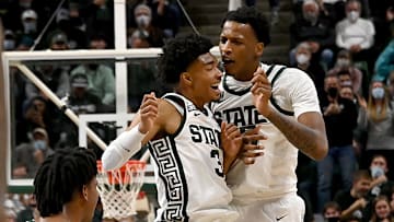 Dec 1, 2021; East Lansing, Michigan, USA;  Michigan State Spartans guard Jaden Akins (3) and forward Marcus Bingham Jr. (30) celebrate a scoring run in the second half at Jack Breslin Student Events Center. Mandatory Credit: Dale Young-Imagn Images