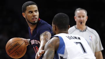 Feb 8, 2015; Auburn Hills, MI, USA; Detroit Pistons guard D.J. Augustin (14) defended by Minnesota Timberwolves guard Lorenzo Brown (7) as he looks for an open man during the third quarter at The Palace of Auburn Hills. Timberwolves beat the Pistons 112-101. Mandatory Credit: Raj Mehta-Imagn Images