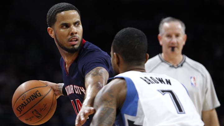Feb 8, 2015; Auburn Hills, MI, USA; Detroit Pistons guard D.J. Augustin (14) defended by Minnesota Timberwolves guard Lorenzo Brown (7) as he looks for an open man during the third quarter at The Palace of Auburn Hills. Timberwolves beat the Pistons 112-101. Mandatory Credit: Raj Mehta-Imagn Images