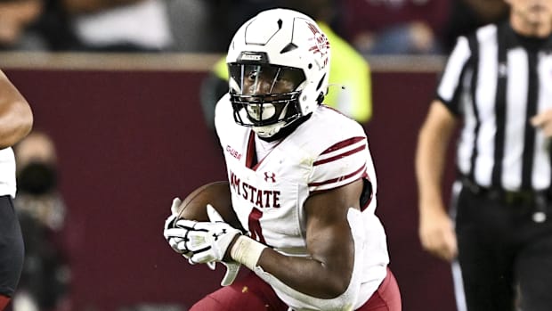 New Mexico State running back Mike Washington (4) runs the ball during the second half against Texas A&M