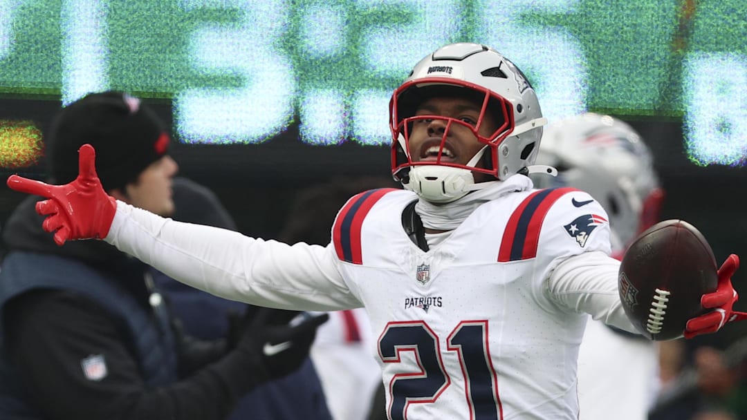 Dec 28, 2025; East Rutherford, New Jersey, USA; New England Patriots safety Jaylinn Hawkins (21) celebrates an interception against the New York Jets during the first quarter of the game at MetLife Stadium. Mandatory Credit: Vincent Carchietta-Imagn Images