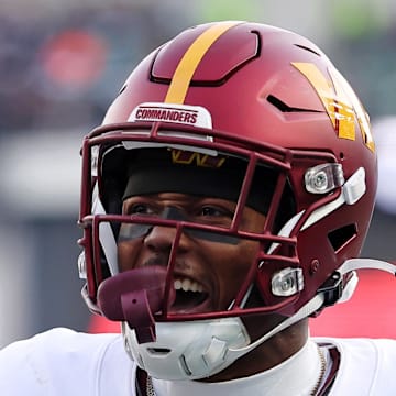 Washington Commanders wide receiver Terry McLaurin reacts after a play with wide receiver Olamide Zaccheaus.