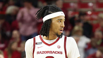 Dec 30, 2024; Fayetteville, Arkansas, USA; Arkansas Razorbacks guard Boogie Fland (2) celebrates with forward Billy Richmond III (24) after scoring in the second half against the Oakland Golden Grizzlies at Bud Walton Arena. Arkansas won 92-62. Mandatory Credit: Nelson Chenault-Imagn Images