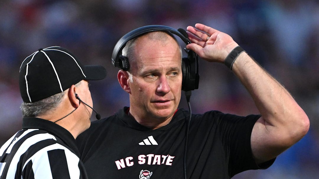 Sep 20, 2025; Durham, North Carolina, USA;  NC State Wolfpack head coach Dave Doeren reacts to a call during the fourth quarter against the Duke Blue Devils at Wallace Wade Stadium. Mandatory Credit: Zachary Taft-Imagn Images