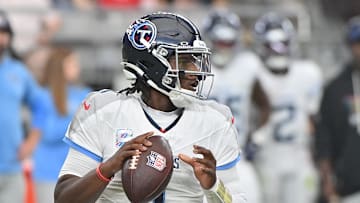 Oct 5, 2025; Glendale, Arizona, USA; Tennessee Titans quarterback Cam Ward (1) looks to throw against the Arizona Cardinals during the fourth quarter at State Farm Stadium. Mandatory Credit: Matt Kartozian-Imagn Images