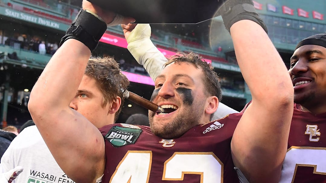 Dec 28, 2023; Boston, MA, USA; Boston College Eagles linebacker Vinny DePalma (42) celebrates defeating the Southern Methodist Mustangs in the Wasabi Fenway Bowl at Fenway Park. Mandatory Credit: Eric Canha-Imagn Images