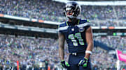 Nov 9, 2025; Seattle, Washington, USA; Seattle Seahawks wide receiver Jaxon Smith-Njigba (11) celebrates after scoring a touchdown during the first quarter against the Arizona Cardinals at Lumen Field. 