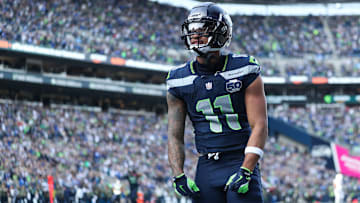 Nov 9, 2025; Seattle, Washington, USA; Seattle Seahawks wide receiver Jaxon Smith-Njigba (11) celebrates after scoring a touchdown during the first quarter against the Arizona Cardinals at Lumen Field. 