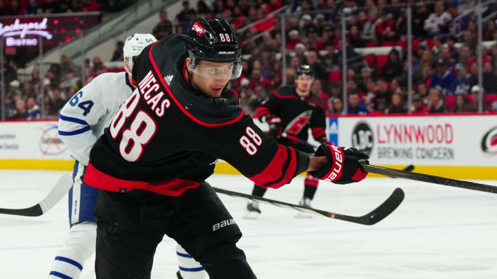 Mar 24, 2024; Raleigh, North Carolina, USA;  Carolina Hurricanes center Martin Necas (88) takes a shot against the Toronto Maple Leafs during the first period at PNC Arena. Mandatory Credit: James Guillory-USA TODAY Sports