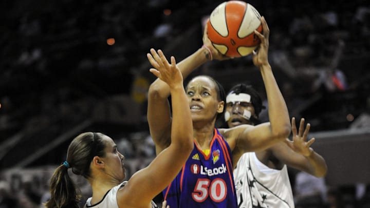 August 28, 2010; San Antonio, TX, USA; Phoenix Mercury center Tangela Smith (50) controls the ball under pressure from San Antonio Silver Stars guard Becky Hammon (25) and forward Crystal Kelly (behind) during the second half at the AT&T Center. Phoenix beat San Antonio 92-73. Mandatory Credit: Brendan Maloney-Imagn Images August 28, 2010; San Antonio, TX, USA; Phoenix Mercury center Tangela Smith (50) controls the ball under pressure from San Antonio Silver Stars guard Becky Hammon (25) and forward Crystal Kelly (behind) during the second half at the AT&T Center. Phoenix beat San Antonio 92-73. Mandatory Credit: Brendan Maloney-Imagn Images