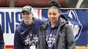 Paige Bueckers and UConn student-athlete Azzi Fudd walk onto the stage during the Final Four Champions victory parade and rally outside of the XL Center in Hartford, CT.