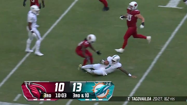 Miami Dolphins quarterback Tua Tagovailoa slides to end a play. Miami Dolphins quarterback Tua Tagovailoa slides to end a play.