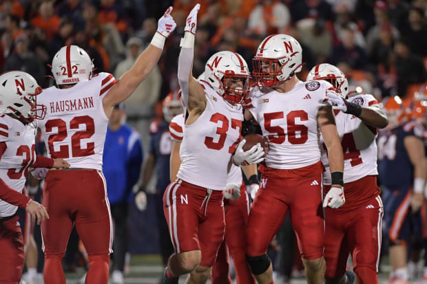 Nebraska Cornhuskers players celebrated a recovered fumble by the Illinois Fighting Illini during the first half