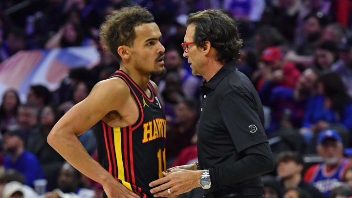 Feb 9, 2024; Philadelphia, Pennsylvania, USA; Atlanta Hawks head coach Quin Snyder talks with guard Trae Young (11) against the Philadelphia 76ers during the fourth quarter at Wells Fargo Center. Mandatory Credit: Eric Hartline-USA TODAY Sports