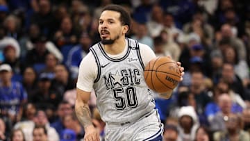 Orlando Magic guard Cole Anthony (50) controls the ball against the Denver Nuggets in the third quarter at Kia Center.