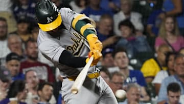 Sep 16, 2024; Chicago, Illinois, USA; Oakland Athletics outfielder Brent Rooker (25) hits a single against the Chicago Cubs during the fifth inning at Wrigley Field. Mandatory Credit: David Banks-Imagn Images
