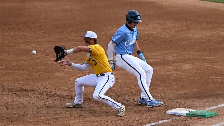May 30, 2026; Chapel Hill, NC, USA; East Carolina Pirates infielder Austin Irby (21) catches the throw to first during game 4 of the Chapel Hill Regional at Boshamer Stadium. Mandatory Credit: William Howard-Imagn Images