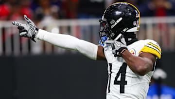 Former Pittsburgh Steelers wide receiver George Pickens (14) reacts after a catch against the Atlanta Falcons in the third quarter at Mercedes-Benz Stadium.