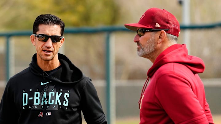 Arizona Diamondbacks general manager Mike Hazen talks to manager Torey Lovullo during spring training workouts at Salt River Fields in Scottsdale on Feb. 17, 2023. Arizona Diamondbacks general manager Mike Hazen talks to manager Torey Lovullo during spring training workouts at Salt River Fields in Scottsdale on Feb. 17, 2023.